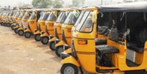 Parked yellow tricycles in parking lot