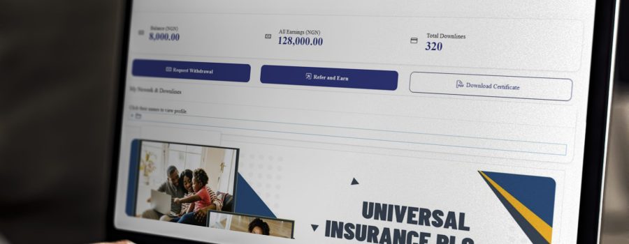 Working on a web template on the laptop - Universal Insurance Network (UIN)
